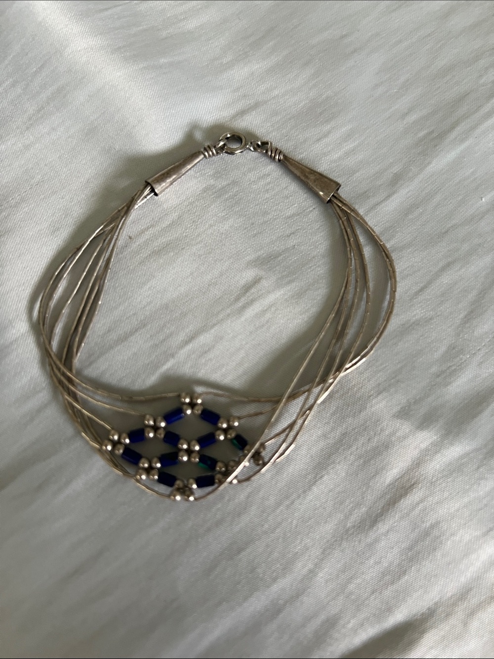 Silver liquid bead Multi-Strand Bracelet with Blue and Green seed bead.